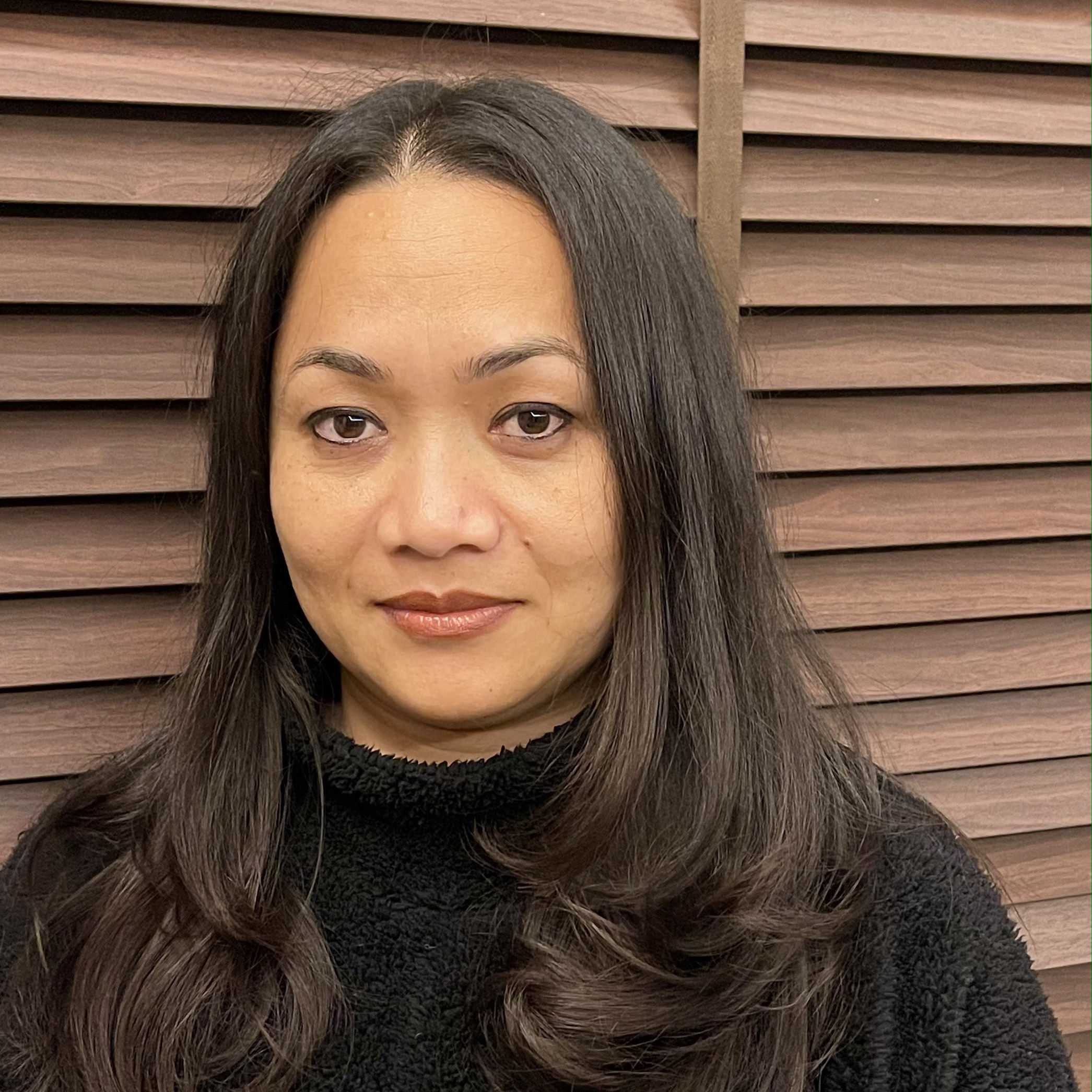 Author photo of Uma Pradhan, a Nepalese woman with long dark hair